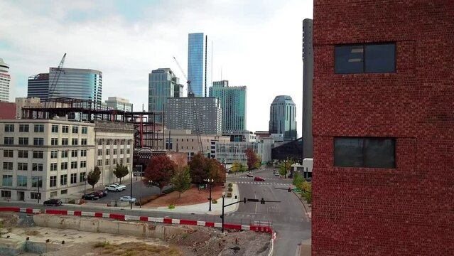 Drone reveals downtown Nashville from behind a building