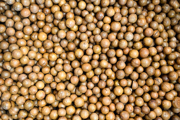 macadamia nuts texture background, fresh natural shelled raw macadamia nuts in a full frame, close up pile of roasted macadamia nut - top view