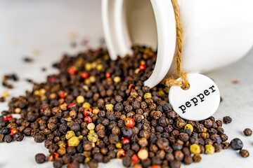 Close-up of mixed peppercorns on the table, selective focus.
