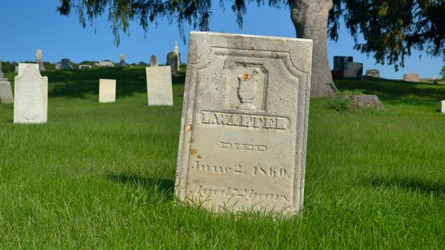 Panning shot of the Grave of the Money digger from the 1800s named Luman Walters who is tied to some of the Money digging stories of Joseph Smith Jr. in upstate New York.