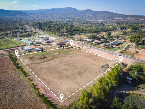 Land plot for building house aerial view, land field with pins, pin location for housing subdivision residential development owned sale rent buy or investment home or house expand the city suburb