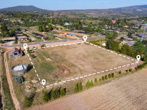 Land plot for building house aerial view, land field with pins, pin location for housing subdivision residential development owned sale rent buy or investment home or house expand the city suburb