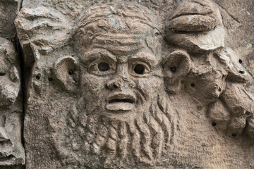 Theatrical mask, fragment of theater decoration with beautiful marble carving, history and heritage of ancient civilizations in the Aegean region of Turkey, vacation travel