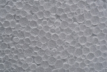 Texture of white foam plastic. Textured background.