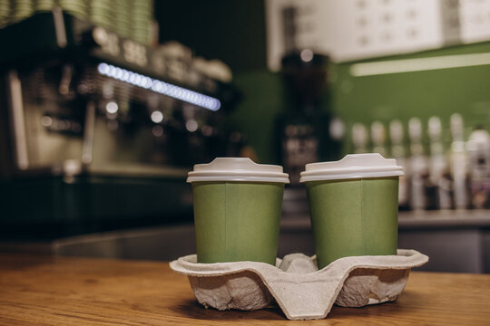 Hot Coffee Cup And Dessert Paper Bag Waiting For Customer On Counter In Modern Cafe Coffee Shop