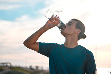 Fitness, exercise and man drinking water for wellness, healthy lifestyle and hydration after...