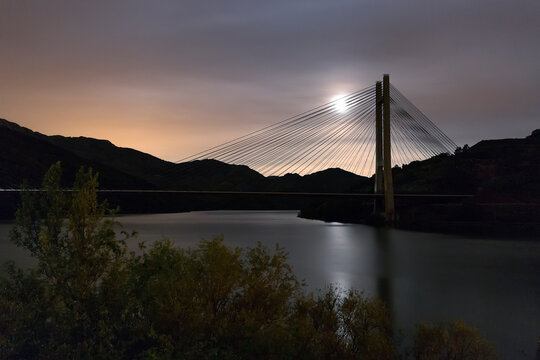 Reservoir bridge of Barrios de Luna, Le&Atilde;&sup3;n. With full moon.