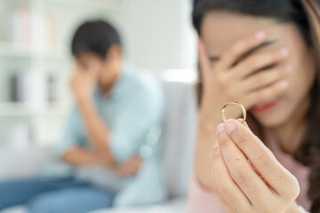 Divorce. Woman remove married ring. Couples desperate and disappointed after marriage. Husband wife sad, upset and frustrated after quarrels conflict. distrust, love problems, betrayals, family, lover