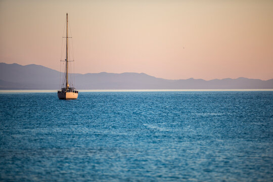 Sailboats at sunrise in Cala Goloritz&Atilde;&uml;. Sardinia, Italy.