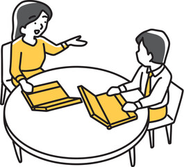 パソコンを手元に置いて打ち合わせする男女