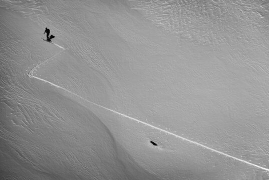 Snowboarders Uses Splitboards To Climb A Mountains At Van Titter Valley, Argentina