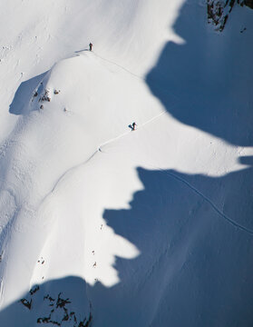 Two Snowboarders Use Splitboard To Climb A Mountain In Van Titter Valley, Argentina