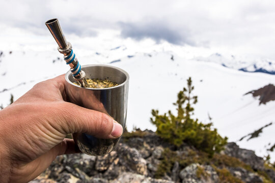 Person holding yerba mate glass, Whistler, British Columbia, Canada