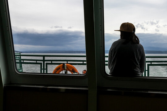Woman riding ferry from Port Townsend to Fort Casey, Washington State, USA