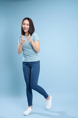 Image of young Asian woman posing on background