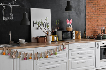 Interior of kitchen with Easter decor and white counters