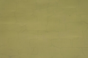 Background - greenish yellow painted wall with cracks