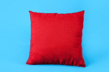 Red pillow on blue background