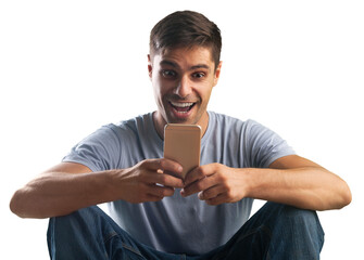 Shocked young man looking at his mobile phone seeing bad news or reading text message