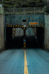 Abandoned underpass that allows vehicles to come back and forth The text on right translates: 