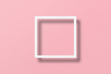paper cut into square shapes with light and shadow Placed on a pink paper background.