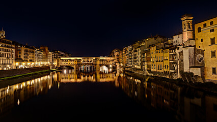 Florence, Tuscany, Italy: night landscape of the italian landmark Ponte Vecchio, the famous medieval bridge over the Arno river
