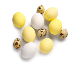 Natural and painted Easter eggs on white background