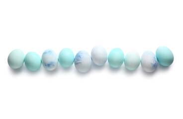 Row of painted Easter eggs on white background