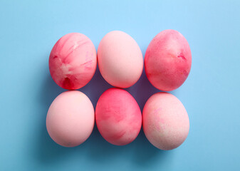 Painted Easter eggs on blue background