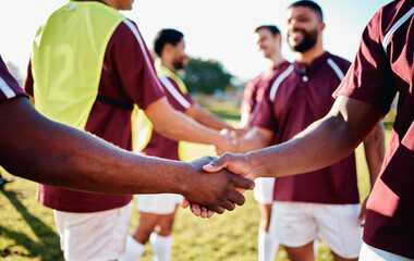 Men, sports and handshake for greeting, introduction or sportsmanship on the grass field outdoors. Sport team shaking hands before match or game for competition, training or workout exercise together