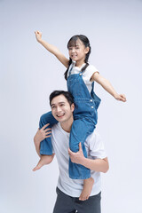 Image of Asian father and daughter on background