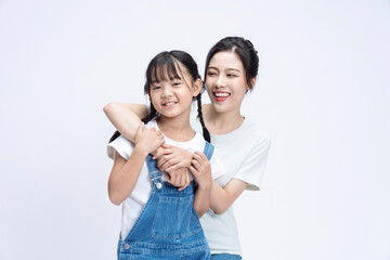 Fototapeta premium Image of Asian mother and daughter on background
