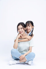 Fototapeta premium Image of Asian mother and daughter on background