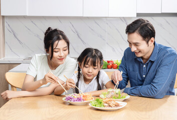 Image of Asian family in the kitchen