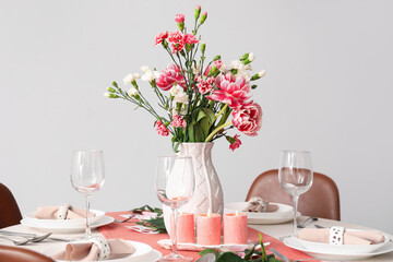 Beautiful table setting for International Women's Day celebration in light room