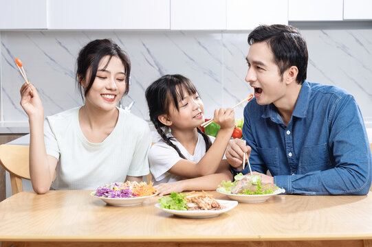Image of Asian family in the kitchen
