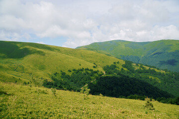 Fototapeta na wymiar Beautiful summer mountain landscape, forest, clouds. Mount Gemba Pylypets Ukraine. Ukrainian mountains Carpathians, Transcarpathia