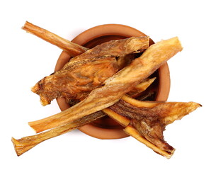 Beef sticks for adult dogs, without sugar, in clay pot isolated on white