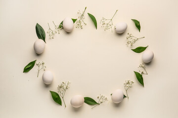 Naklejka na ściany i meble Frame made of Easter eggs, green leaves and gypsophila flowers on white background