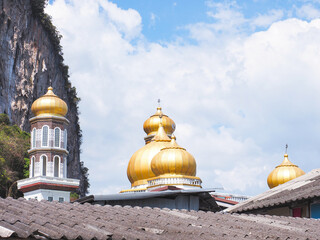 Golden dome of mosque in blue sky