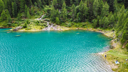 Lake Pian Palù, with its unmistakable emerald-coloured waters, is one of the iconic places in Sole Valley, Stelvio National Park, Trentino Alto Adige, Italy