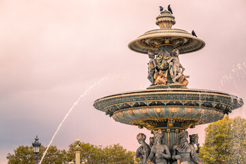 Maritime fountain on the Place de la Concorde square in Paris, France at sunset