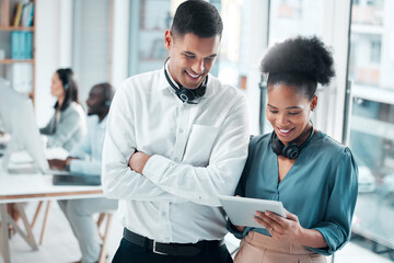 Call center, team and tablet with consultant and CRM, communication and contact us with happy partnership. Man with black woman in customer service, tech support or telemarketing with diversity