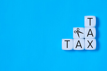 scissors cutting tax,  reduce or taxes cut concept and copy space