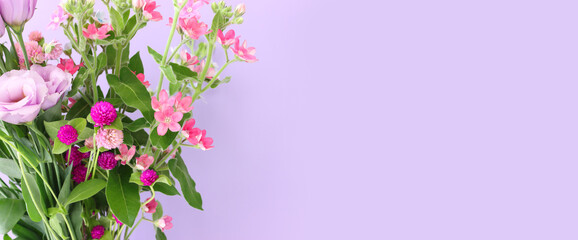 Fototapeta na wymiar Top view image of pink and purple flowers composition over pastel background