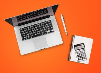 Fototapeta na wymiar Office calculator and laptop computer on desk