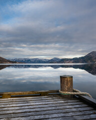 wooden pier at the fjord in Rognan Norway, beautiful calm water