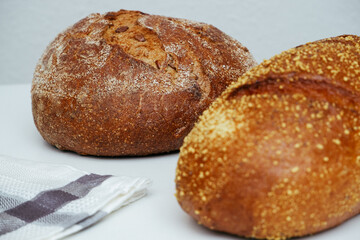 Close-Up Of Bread On White Background. Food, baking and cooking concept - close up of bread