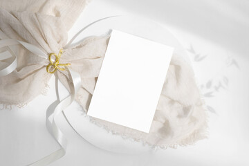 Invitation card mockup on white plate 