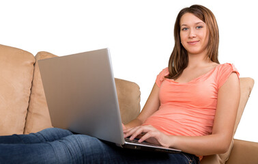 Naklejka premium Portrait of a Young Woman Using her Laptop While Sitting on a Couch
